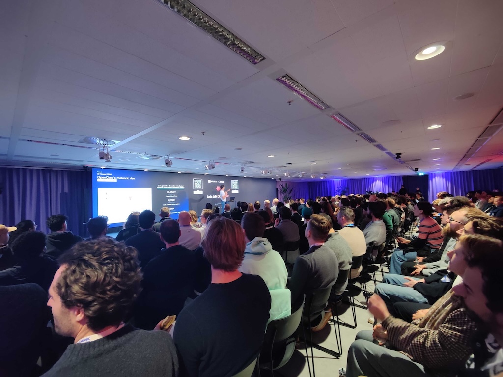 Audience watching Job Rietbergen speak at an event