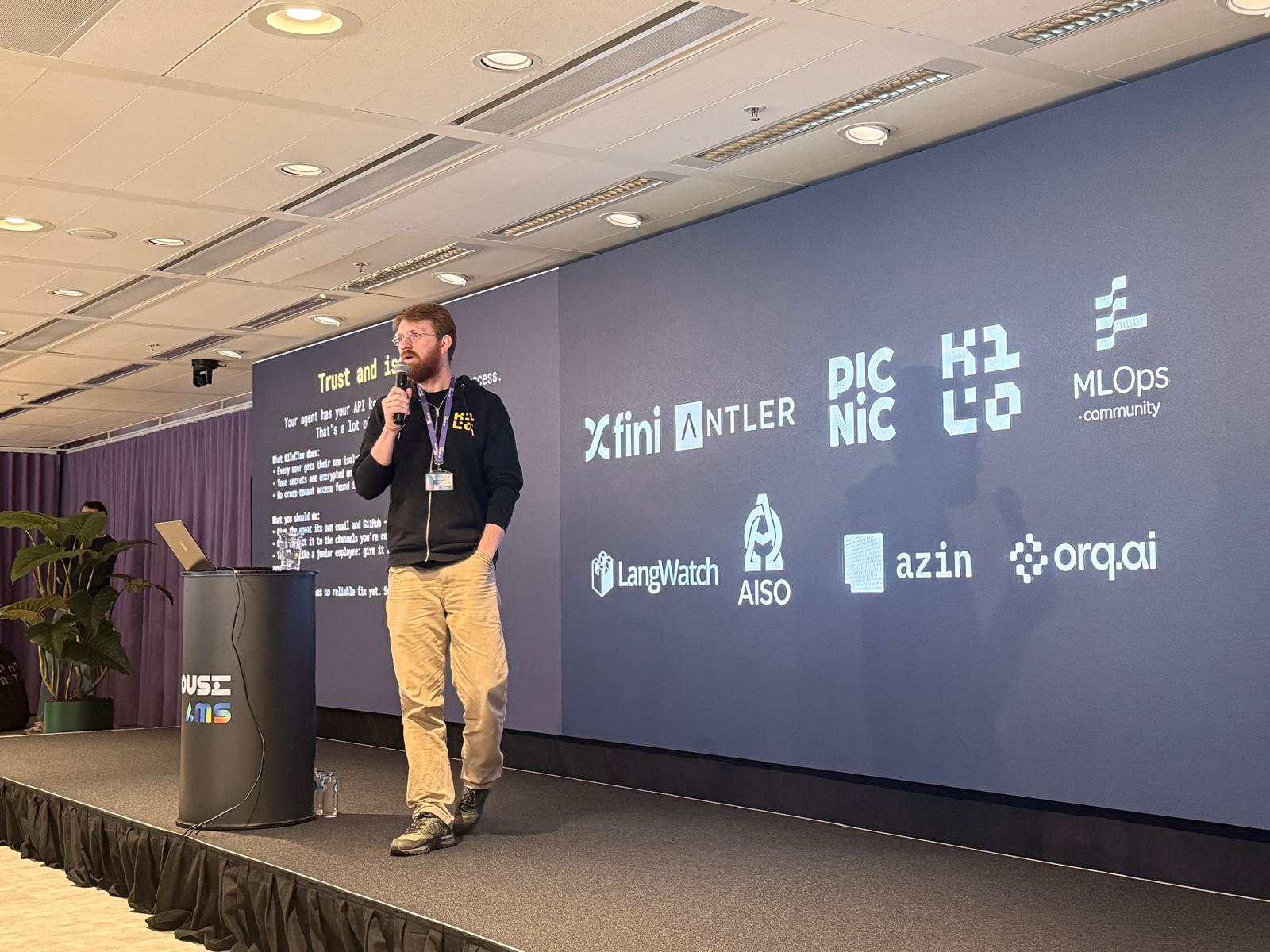 Job Rietbergen speaking on stage at an AI event